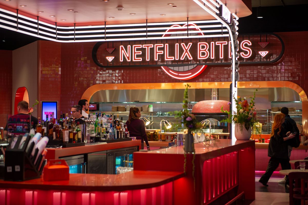 People linger in the restaurant of the Netflix House experience center Monday in Philadelphia. Netflix opens its first experience center. The first Netflix House, in a suburb of Philadelphia, features escape rooms, mini golf, a merchandise store, a movie theater and a restaurant, among other things. (Andrej Sokolow/dpa via ZUMA Press/TNS)