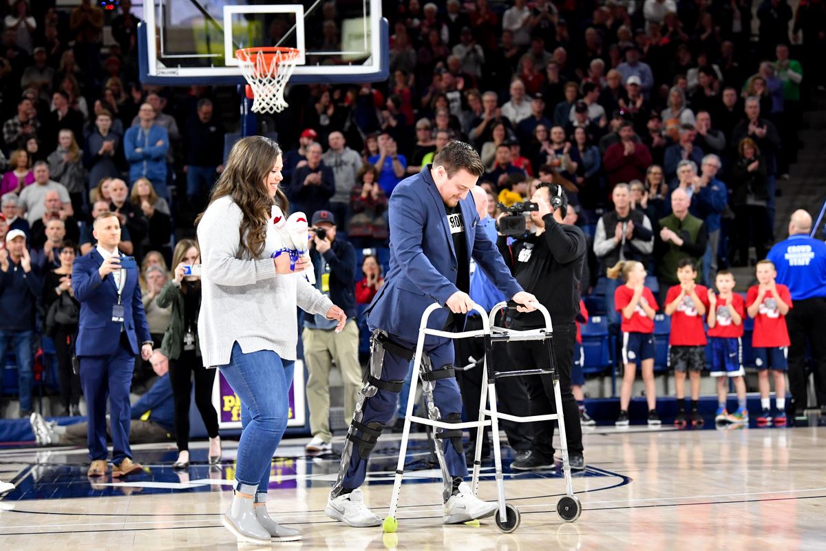 Gonzaga basketball team manager Mac Graff walks onto the court and receives a standing ovation during senior night before the start of the first half of a college basketball game on Saturday, February 29, 2020, at McCarthy Athletic Center in Spokane, Wash. (Tyler Tjomsland / The Spokesman-Review)