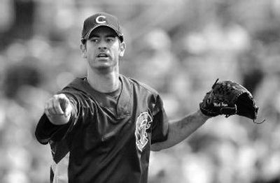 
Chicago Cubs starting pitcher Mark Prior directs teammates to a pop fly from Seattle Mariners' Ben Broussard. 
 (Associated Press / The Spokesman-Review)