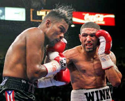 
Winky Wright, right, controlled Saturday night's fight in Las Vegas by connecting time after time with hard rights against Felix Trinidad.
 (Associated Press / The Spokesman-Review)