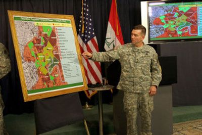 
Major. Gen. William B. Caldwell, the top U.S. military spokesman in Iraq, points to a map of Baghdad during a press conference Wednesday. 
 (Associated Press / The Spokesman-Review)