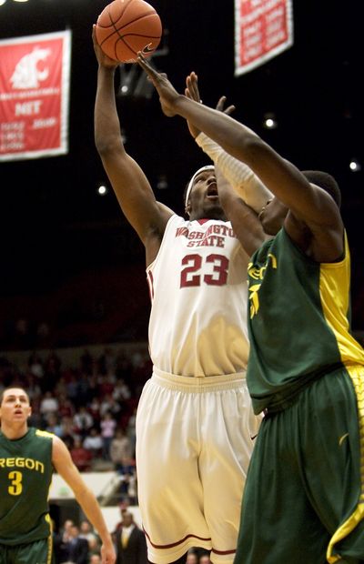 WSU thought it had defeated Oregon on this DeAngelo Casto basket Thursday in the first OT, but wound up losing in two OTs.  (Associated Press)