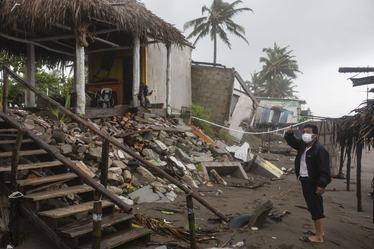 A man inspects the damage after a part of his home was toppled by winds brought on by Hurricane Grace, in Tecolutla, Veracruz State, Mexico, Saturday, Aug. 21, 2021. Grace hit Mexico’s Gulf shore as a major Category 3 storm before weakening on Saturday, drenching coastal and inland areas in its second landfall in the country in two days.  (Felix Marquez)