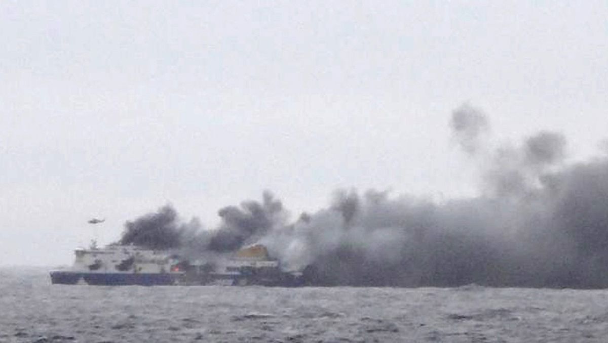 In this photo taken from a nearby ship, smoke rises from the Italian-flagged Norman Atlantic after it caught fire.