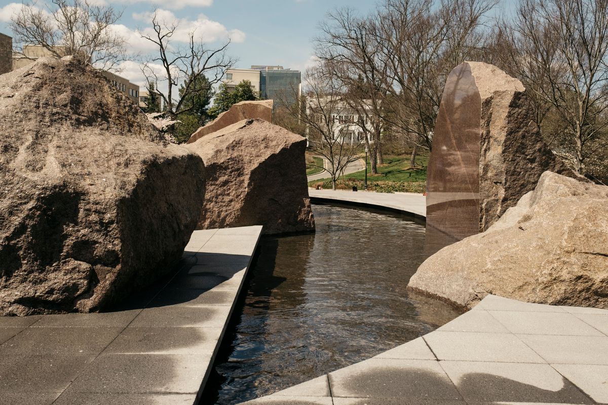 A crescent-shaped reflecting pool is featured in Elyn Zimmerman's sculpture "Sudama" at its new home on the campus of American University in Washington, March 30, 2023. One of the changes in the sculpture in its new location is the shape of the reflecting pool. (Justin T. Gellerson/The New York Times)  (JUSTIN T. GELLERSON)