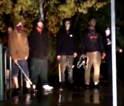 A photo depicting young masked males behind a “purge” scare Sunday night in McEuen Park in Coeur d’Alene. (Coeur d’Alene Police Department)