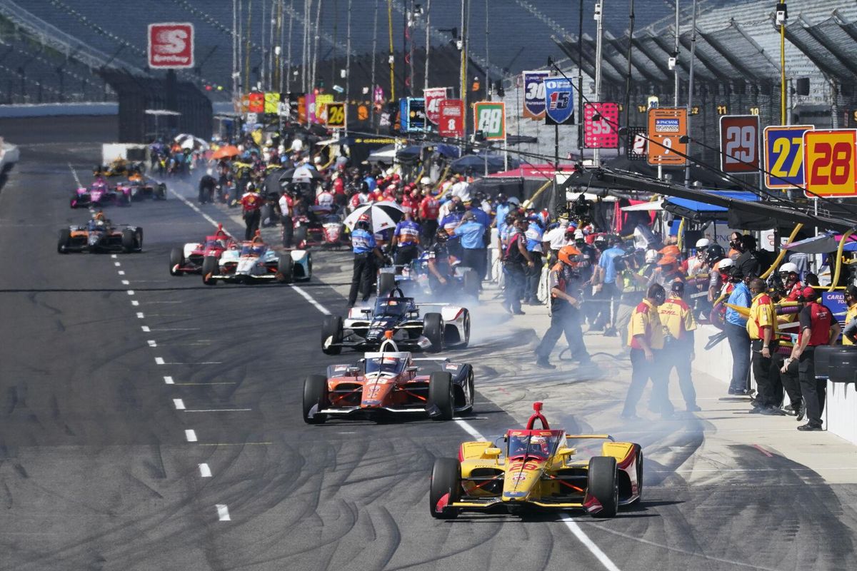 Ryan Hunter-Reay leads a group of cars off pit lane during a practice session for the Indianapolis 500 auto race at Indianapolis Motor Speedway, Sunday, Aug. 16, 2020, in Indianapolis.  (Darron Cummings)