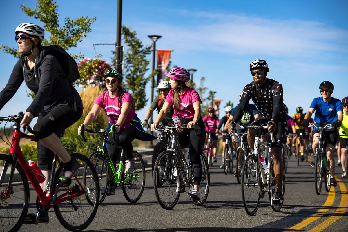 In Kendall Yards, cyclists start their ride during the annual SpokeFest on Sunday, Sept. 9, 2018. Hundreds of bike riders tackled various routes from 9, 21, and 50 miles long. (Colin Mulvany / The Spokesman-Review)