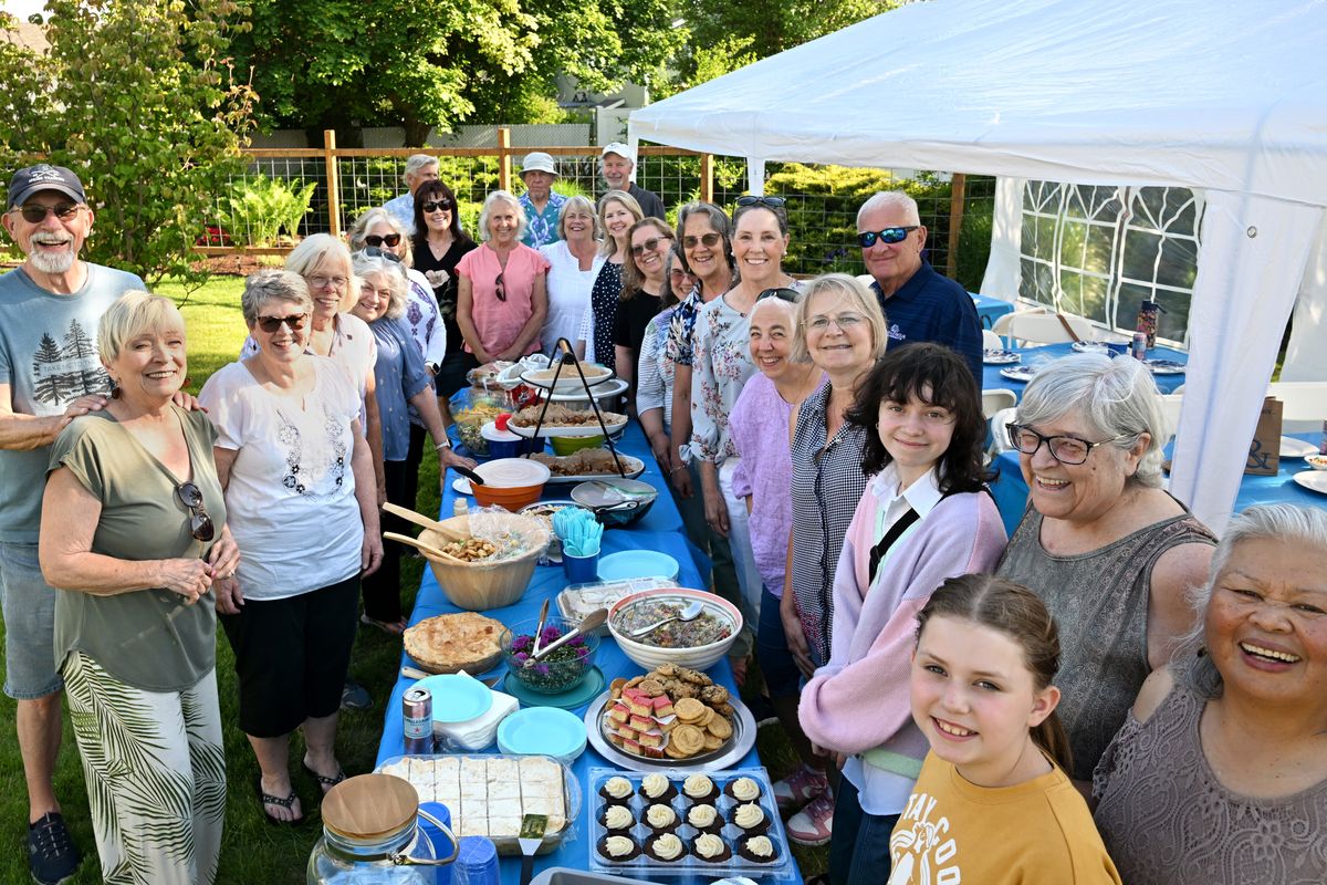 Current members of the Little Spokane Garden Club gather around the table at their annual potluck at the home of Kirk and Doann Lovell in the Colbert area June 5. The group has focused on gardening for 75 years of existence. (Jesse Tinsley/THE SPOKESMAN-REVIEW)
