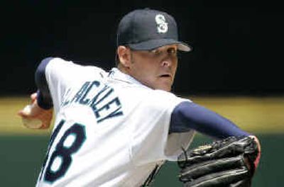 
Seattle Mariners starting pitcher Travis Blackley throws against the Texas Rangers in the first inning. Blackley, a native of Australia, made his major league debut and won the game. 
 (Associated Press / The Spokesman-Review)