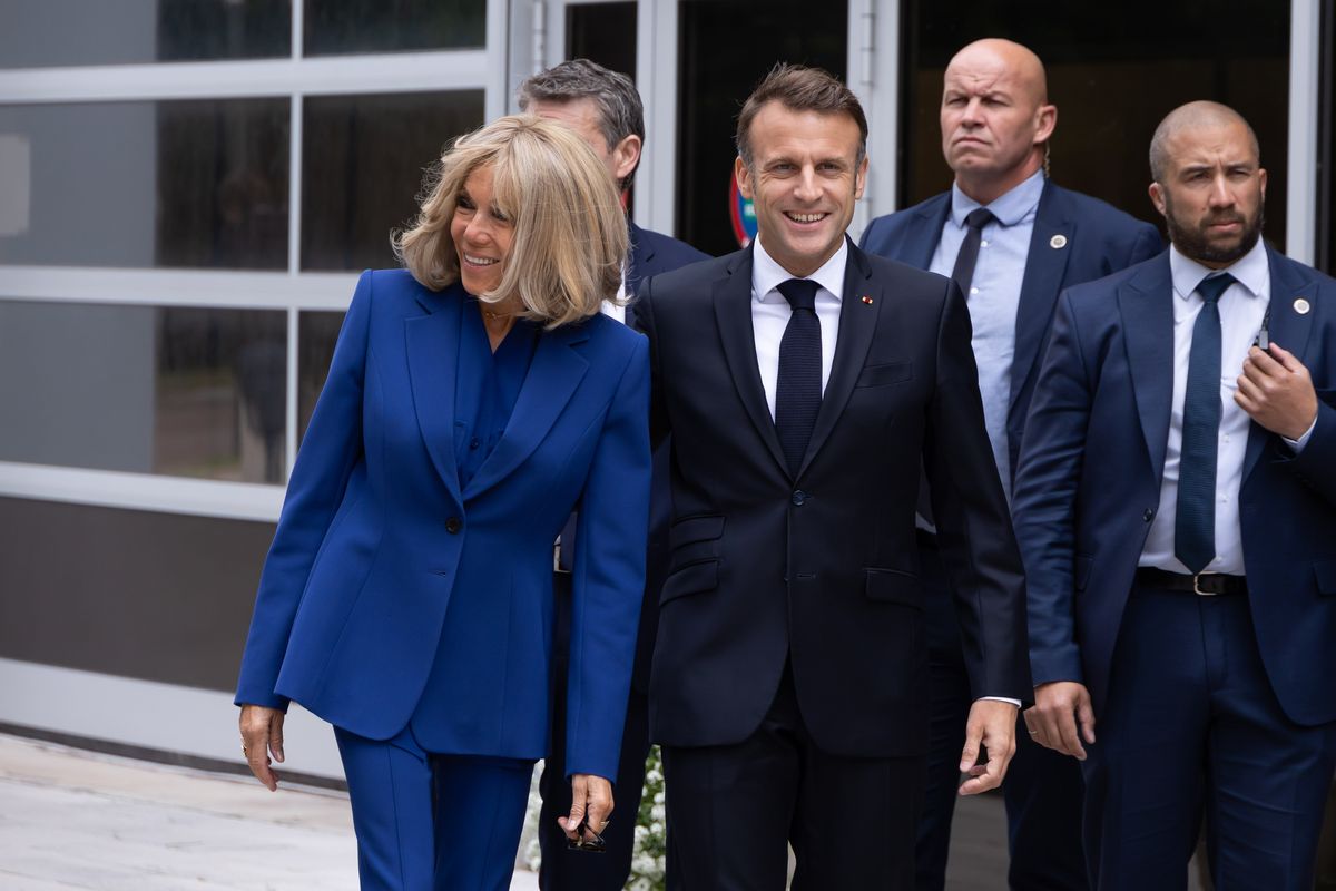 French President Emmanuel Macron and his wife Brigitte Macron arrive at the voting station on Sunday in Le Touquet-Paris-Plage, France. (Sébastien Courdji)