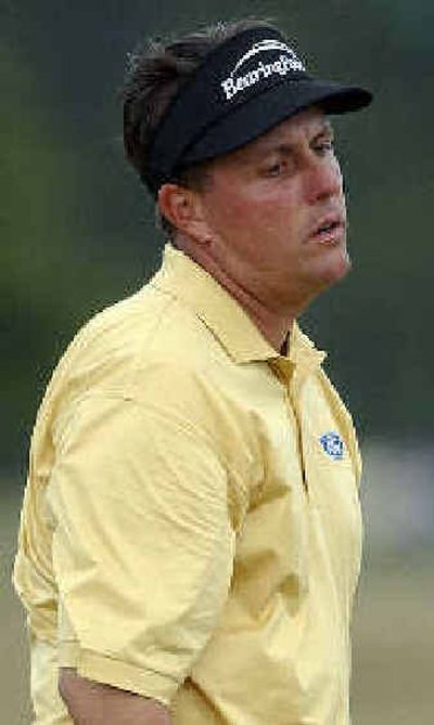 
Phil Mickelson sighs after a double bogey on the notorious seventh hole during the third round.
 (Associated Press / The Spokesman-Review)