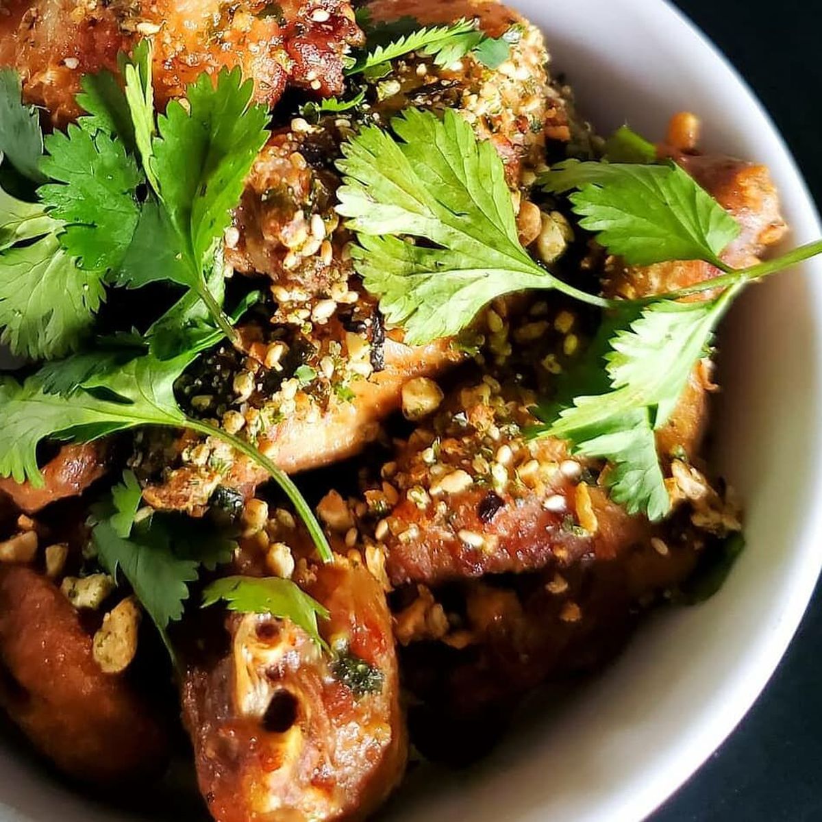 Chef C.J. Callahan recommends Hogwash Whiskey Den’s “miso-honey”-flavored chicken wings. The cracklins are another popular honey-fied item.  (Courtesy)