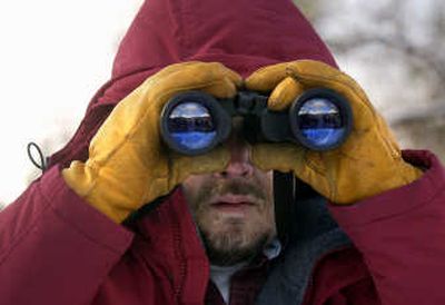 
Brian Flick looks for a rough-legged hawk in Peaceful Valley during a past Audubon Society Christmas Bird Count. 
 (File / The Spokesman-Review)