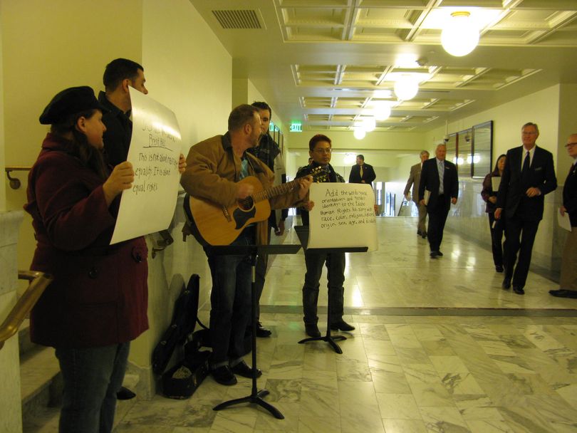 A five-member musical flash mob fills a Statehouse corridor with harmonies Friday in an 