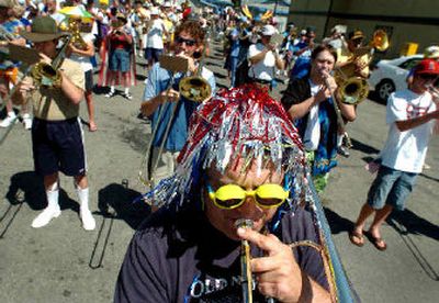 
Dennis Grant and other members of the Perfection Not community marching band prepare to start the parade Tuesday in  Coeur d'Alene. More than 70 groups participated in the parade. 
 (Joe Barrentine / The Spokesman-Review)