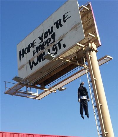 This image provided by KVVU-TV shows a billboard with a mannequin dangling from a hangman's noose near The Strip in Las Vegas. Authorities said calls began coming in early Wednesday Aug. 8, 2012, from drivers worried the dummy along Interstate 15 near was a real person. A Nevada Highway Patrol spokesman said the sign is a publicity stunt done in bad taste. A woman who answered the phone at Lamar Advertising Co. says the sign was not authorized and was being removed. (AP Photo/KVVU, Peter Dawson) ((AP Photo/KVVU, Peter Dawson))