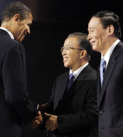 President Barack Obama meets with Chinese Vice Premier Wang Qishan, right, and Chinese State Councilor Dai Bingguo in Washington, D.C., on Monday.  (Associated Press / The Spokesman-Review)