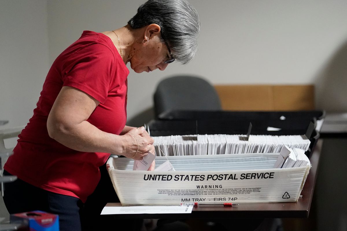 An election worker continues the process in counting ballots for the Pennsylvania primary election, Wednesday, May 18, 2022, at the Mercer County Elections Board in Mercer, Pa. Vote counting continues as Republican candidates Dr. Mehmet Oz and David McCormick are locked in a too-early-to-call race for Pennsylvania