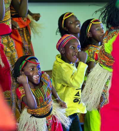 Rachael Mulungi, 7, and Brian Ocen, 8, along with 20 other performers from the Watoto Children’s Choir, dance and sing at the Prince of Peace Lutheran Church on Indian Trail Road, April 3, 2014, in Spokane, Wash. A Watoto choir will give performances this week in the Spokane area. (Dan Pelle / The Spokesman-Review)