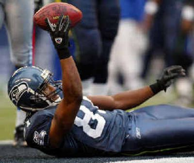 
After early season woes, Seattle receiver Koren Robinson appears to have a solid grip of the football. 
 (Associated Press / The Spokesman-Review)