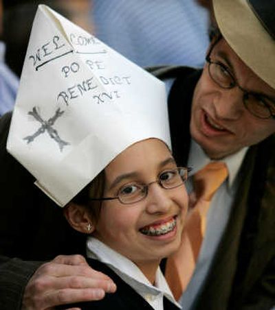 
Mary Taft, 11, wears a papal hat made by her mother as she waits with her father for the arrival of Pope Benedict XVI at St. Joseph Parish in New York on Friday. Associated Press
 (Associated Press / The Spokesman-Review)