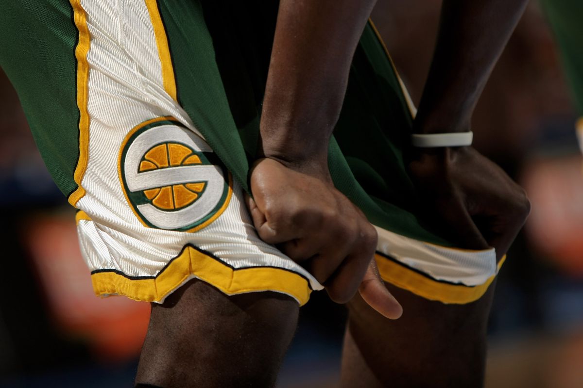 A member of the Seattle SuperSonics awaits action against the Denver Nuggets at the Pepsi Center on March 16, 2008 in Denver, Colorado.  (Doug Pensinger)