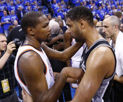 Thunder forward Kevin Durant, left, talks with Spurs center Tim Duncan, following Oklahoma City’s Game 6 win in San Antonio. (Alonzo Adams / Associated Press)