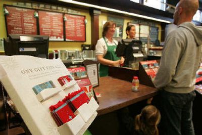 
In the five years since the Starbucks launched its Starbucks Card, it's become a fixture in the wallets of millions of loyal customers. It's also emerged as one of the company's most heavily promoted and hottest-selling holiday gift items. 
 (Associated Press / The Spokesman-Review)