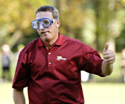 
Woody Austin wears swimming goggles as he plays the 14th hole Sunday. Austin fell in the water while playing the hole on Friday.Associated Press
 (Associated Press / The Spokesman-Review)