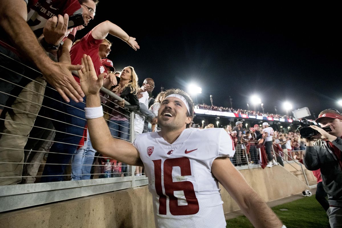 Washington State Cougars quarterback Gardner Minshew (16) celebrates with fans after WSU defeated Stanford during the second half of a college football game on Saturday, October 27, 2018, at Stanford Stadium in Stanford, Calif. WSU won the game 41-38. (Tyler Tjomsland / The Spokesman-Review)