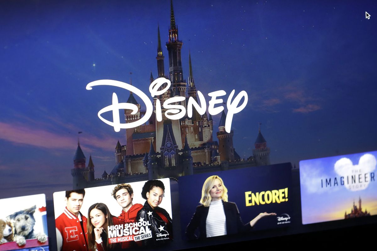 FILE - In this Wednesday, Nov. 13, 2019, file photo, a Disney logo forms part of a menu for the Disney Plus movie and entertainment streaming service on a computer screen in Walpole, Mass. Streaming services ranging from Netflix to Disney+ want us to stop sharing passwords. That's the new edict from the giants of streaming media, who hope to discourage the common practice of sharing account passwords without alienating their subscribers, who've grown accustomed to the hack.  (Steven Senne)