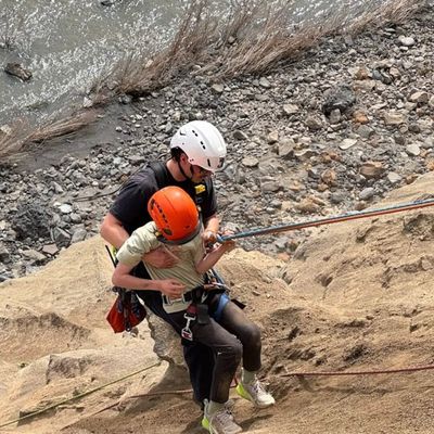 Firefighters rescue one of two boys trapped March 31 on the bluffs alongside High Drive on Spokane’s South Hill. City of Spokane firefighters work closely with Spokane Valley and Spokane Fire District No. 9 crews during technical rescue operations that require redundant safety systems. Federal grants help to ensure each of the three teams have consistent equipment.  (Courtesy photo)