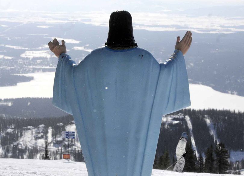 In this Feb. 20, 2011 file photo, the statue of Jesus Christ at Whitefish Mountain Resort overlooks Whitefish Lake and the Flathead Valley in Whitefish, Mont. A Montana judge says a 6-foot-tall statue of Jesus that was placed on federal land on Big Mountain near Whitefish nearly 60 years ago can remain. (Associated Press)