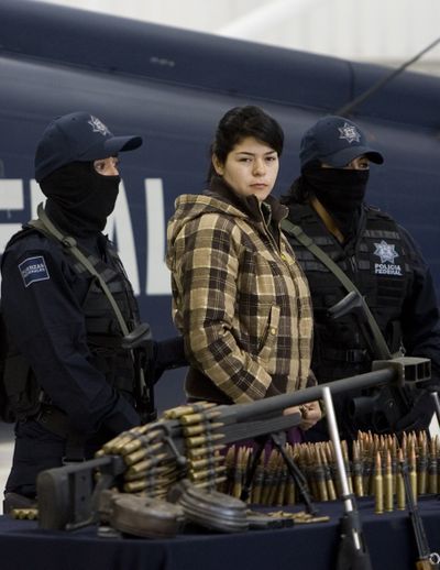 Anahi Beltran Cabrera was arrested in Mexico City, Tuesday, guarding an arsenal allegedly belonging to a group linked to the powerful Beltran Leyva drug cartel.  (Associated Press / The Spokesman-Review)