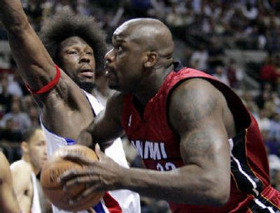 
Miami's Shaquille O'Neal looks to score as Detroit's Ben Wallace defends Tuesday night. Miami won 91-86.
 (Associated Press / The Spokesman-Review)