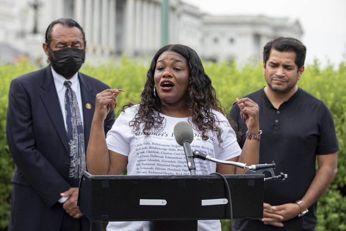 FILE - In this Aug. 3, 2021, file photo Rep. Cori Bush, D-Mo., flanked by Rep. Al Green, D-Texas, left, and Rep. Jimmy Gomez, D-Calif., right, speaks to the press after it was announced that the Biden administration will enact a targeted nationwide eviction moratorium outside of Capitol Hill in Washington. Several progressive lawmakers, including Bush, on Tuesday, Sept. 21, introduced a bill that would reimpose a nationwide eviction moratorium at a time when deaths from COVID-19 are running at their highest levels since early March.  (Amanda Andrade-Rhoades)