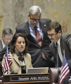 OLYMPIA -- Sens. Mark Schoesler, right, Steve Litzow and Ann Rivers monitor the vote count on an amendment to the medical marijuana bill Rivers sponsored. (Jim Camden)