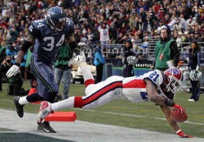 
Buffalo's Willis McGahee scored four touchdowns as the Bills handed Seattle its worst loss of the Mike Holmgren era. Monday, Holmgren tried to inspire the troops by comparing them to the 1988 49ers.
 (Associated Press / The Spokesman-Review)