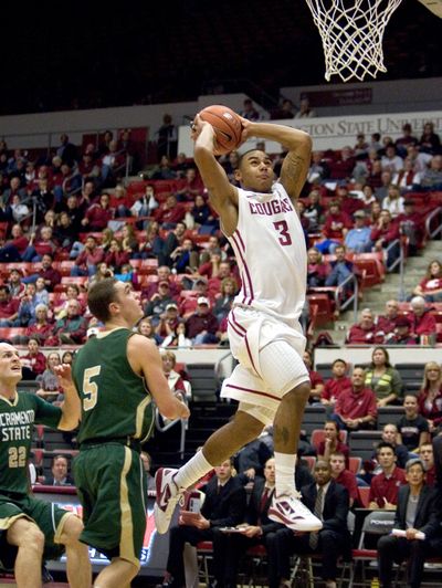 Washington State guard DaVonte Lacy (3) goes in for a dunk as Sacramento State guard Dylan Garrity (5) watches during the second half of an NCAA college basketball game Thursday, Nov. 17, 2011, in Pullman, Wash. Lacy scored 15 points as Washington State won 79-68. (Dean Hare / Fr158448 Ap)