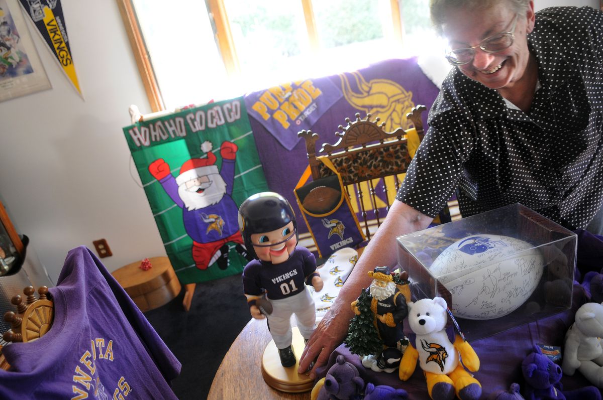Phyllis Mitzel shows off part of her Vikings shrine, a back room of her house that she reserves for her memorabilia collection at her home in Cheney. Mitzel said starting Sunday morning, she doesn’t answer her door or her phone during a game.  (Photos by RAJAH BOSE / The Spokesman-Review)