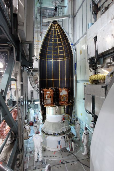 In this Aug. 25 photo made available by NASA, technicians add a payload fairing to the Gravity Recovery and Interior Laboratory booster at the Kennedy Space Center in Cape Canaveral, Fla. (Associated Press)