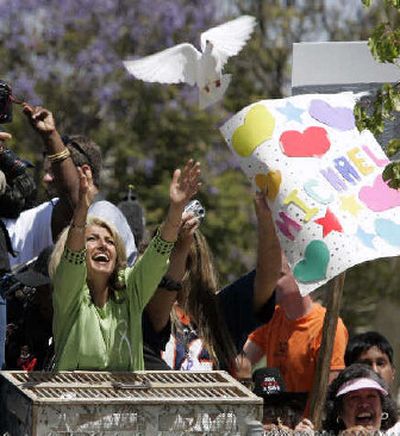 
A fan releases a dove outside Santa Barbara County Superior Court in Santa Maria, Calif., on Monday after Michael Jackson's acquittal. 
 (Associated Press / The Spokesman-Review)