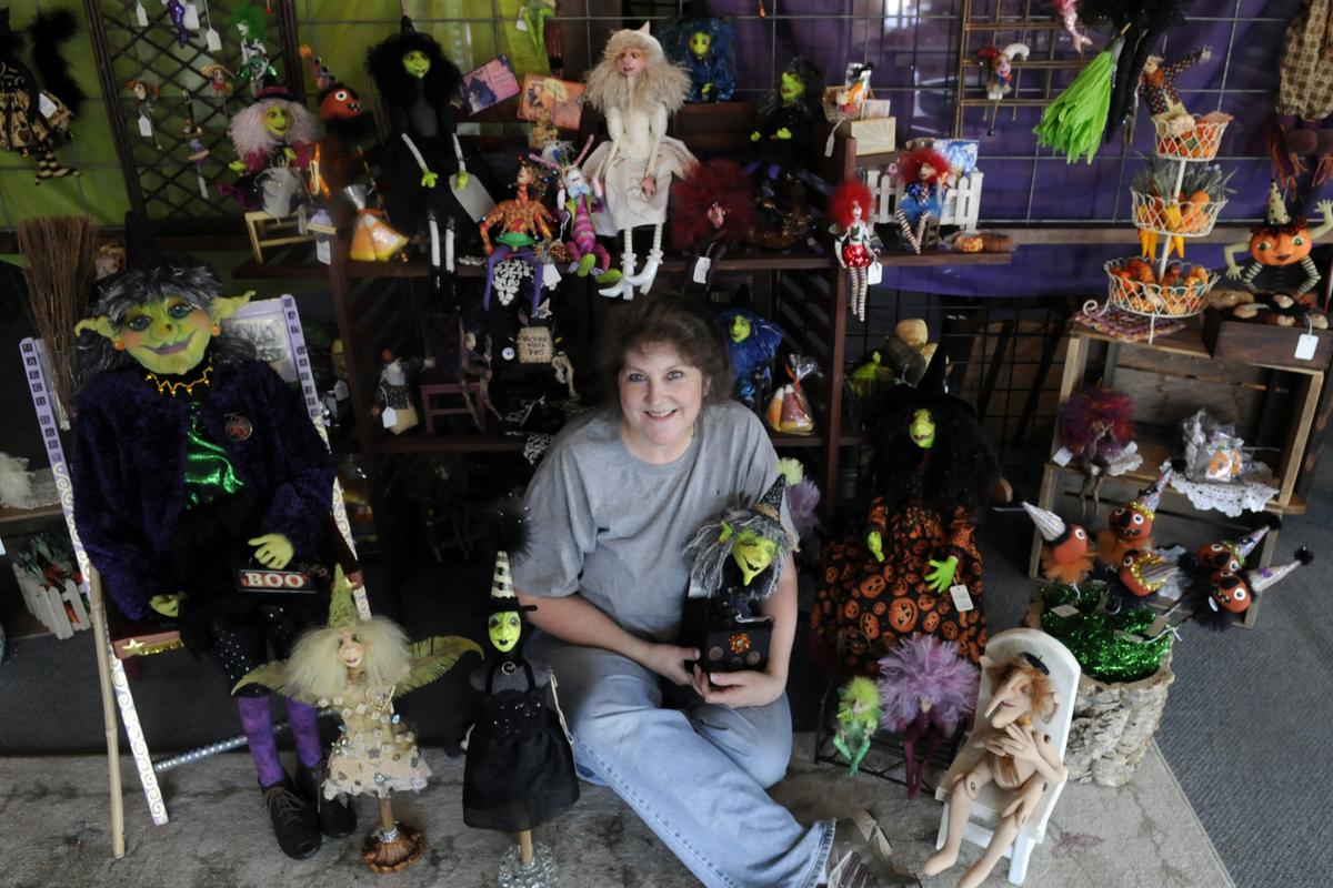 Susan Burger sits in her kiosk called the Futile Fairie, at the Local Marketplace, 122 N. Argonne Road, where she sells her handcrafted dolls. (J. BART RAYNIAK / The Spokesman-Review)