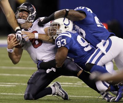 Houston quarterback Matt Schaub is sacked by Colts Dwight Freeney (93) and Robert Mathis. (Associated Press)