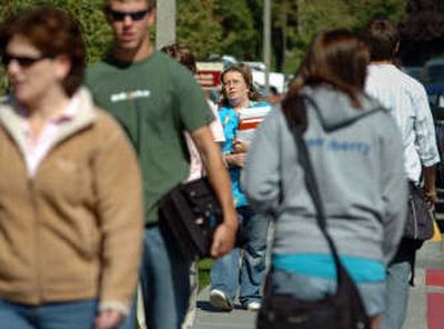 
Lisa Nolan, center, a nursing student from St. Maries, joins other students heading to the student union building for lunch Wednesday at North Idaho College. 
 (Jesse Tinsley / The Spokesman-Review)
