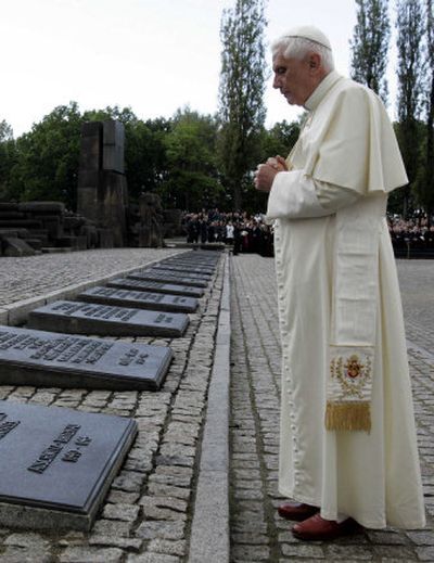 
Pope Benedict XVI prays Sunday in front of the memorial plaques at the former Nazi death camp in Birkenau, Poland. 
 (Associated Press / The Spokesman-Review)