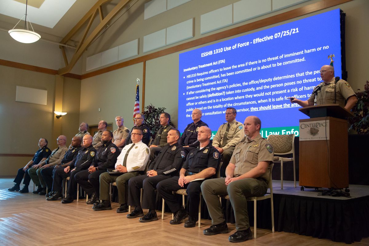 Nearly 20 Eastern Washington law enforcement agencies attend and host a news conference Thursday at CenterPlace Regional Event Center in Spokane Valley. Representatives from the area agencies expressed concerns with some of legislative and public safety updates that will go into effect on Sunday in the state.  (Libby Kamrowski/The Spokesman-Review)