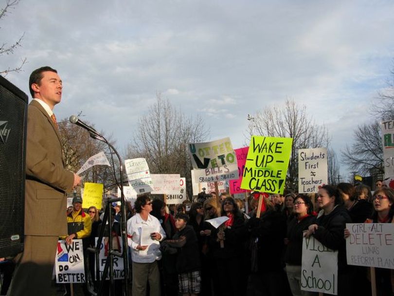 Rep. Brian Cronin, D-Boise, addresses a teachers' rally in Capitol Park late Wednesday afternoon, protesting the enactment of legislation limiting teacher collective bargaining rights and imposing a merit pay plan. After he spoke, the crowd began chanting, 