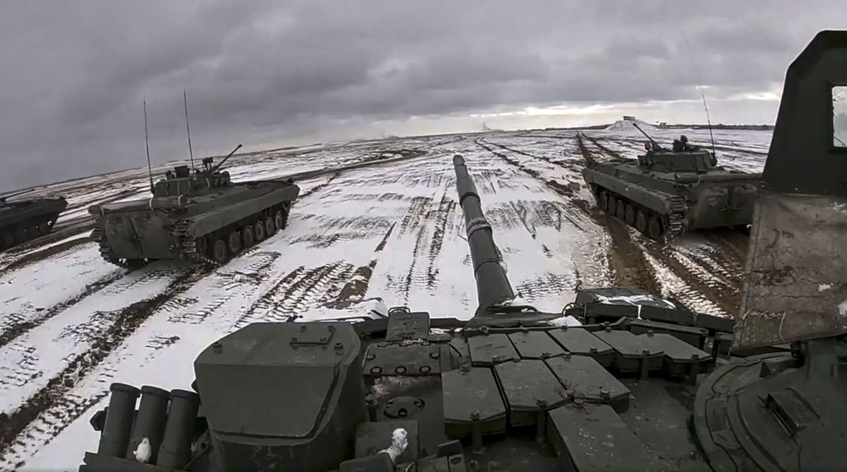 FILE - In this image from video released by the Russian Defense Ministry Press Service on Wednesday, Feb. 2, 2022, Russian and Belarusian tanks drive during a joint military drills at Brestsky firing range, Belarus. A buildup of an estimated 100,000 Russian troops near Ukraine has fueled Western fears of an invasion, but Moscow has denied having plans to launch an attack while demanding security guarantees from the the U.S. and its allies. (HOGP)